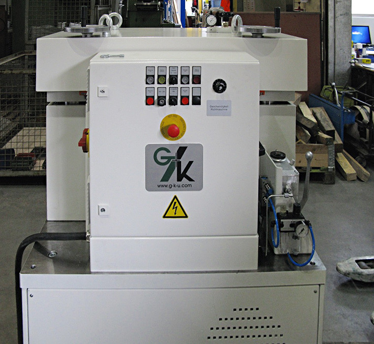 Picture shows a stamped parts straightening machine